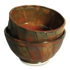 These tea bowls created by Tracy Gamble were glazed with two coats of PC-59 Deep Firebrick in tall oval patterns, then three coats of PC-53 Ancient Jasper over the entire bowls.